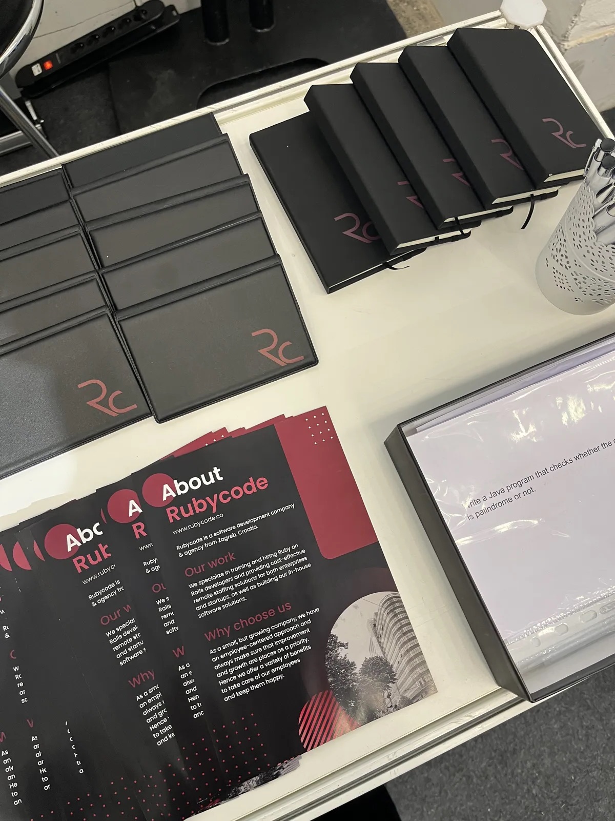Printed Rubycode brand materials on an event stand
