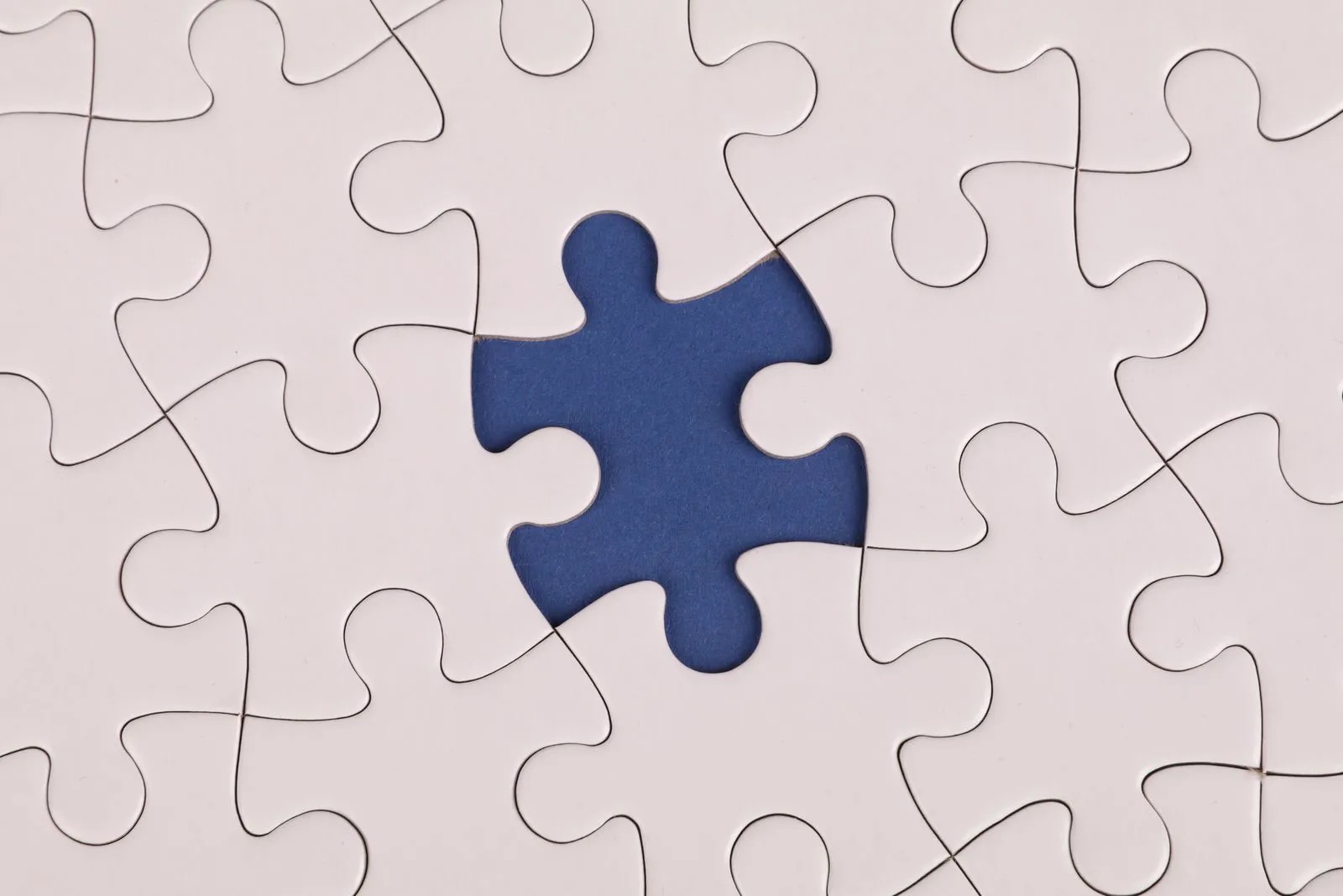 A jigsaw puzzle with one piece missing